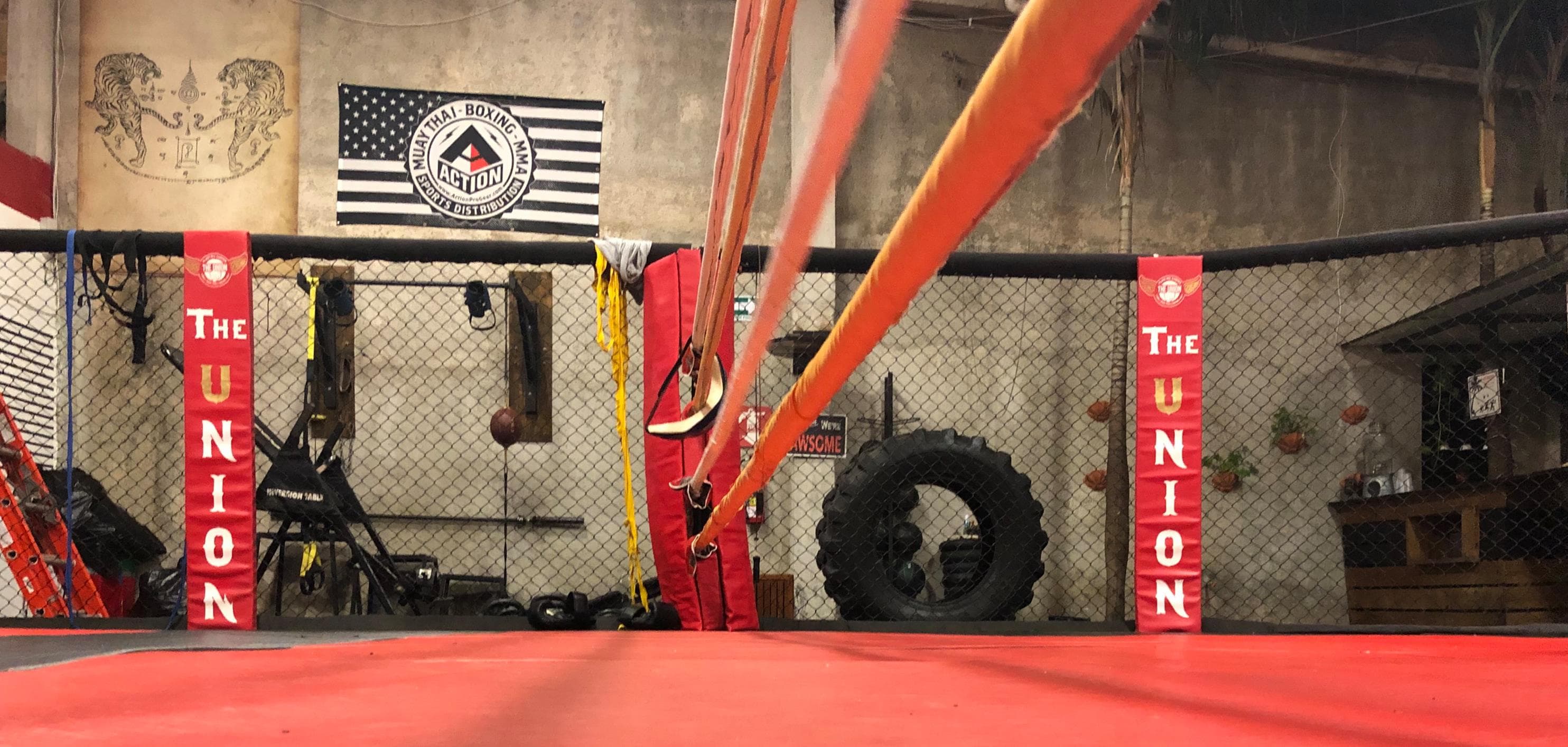 Boxing ring view from training mats at The Union Gym, showing the professional fight arena where authentic Muay Thai and Boxing training occurs