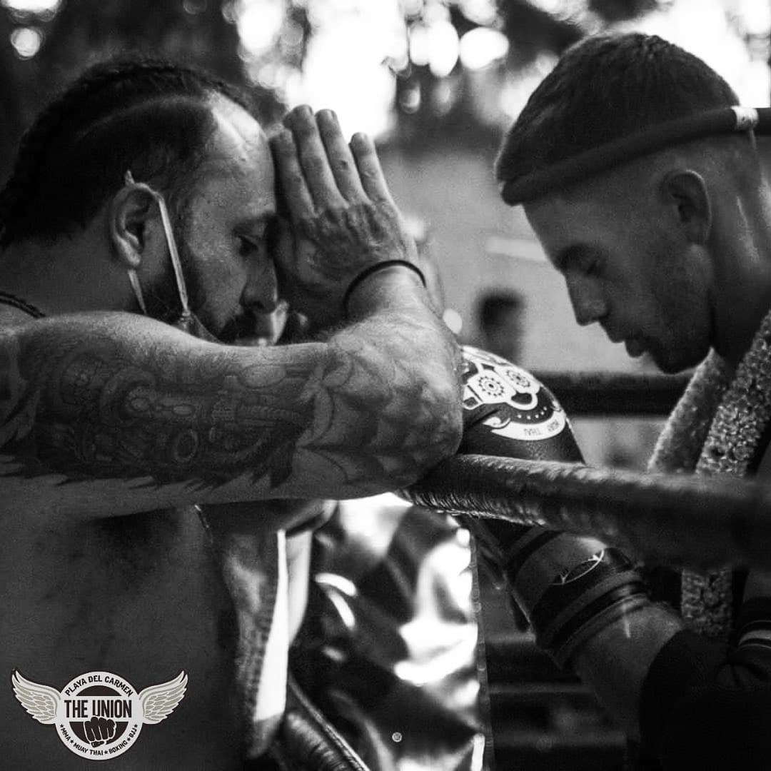 Traditional pre-fight Kru blessing ceremony at The Union Gym, featuring Muay Thai Mongkol headgear and authentic Thai boxing rituals