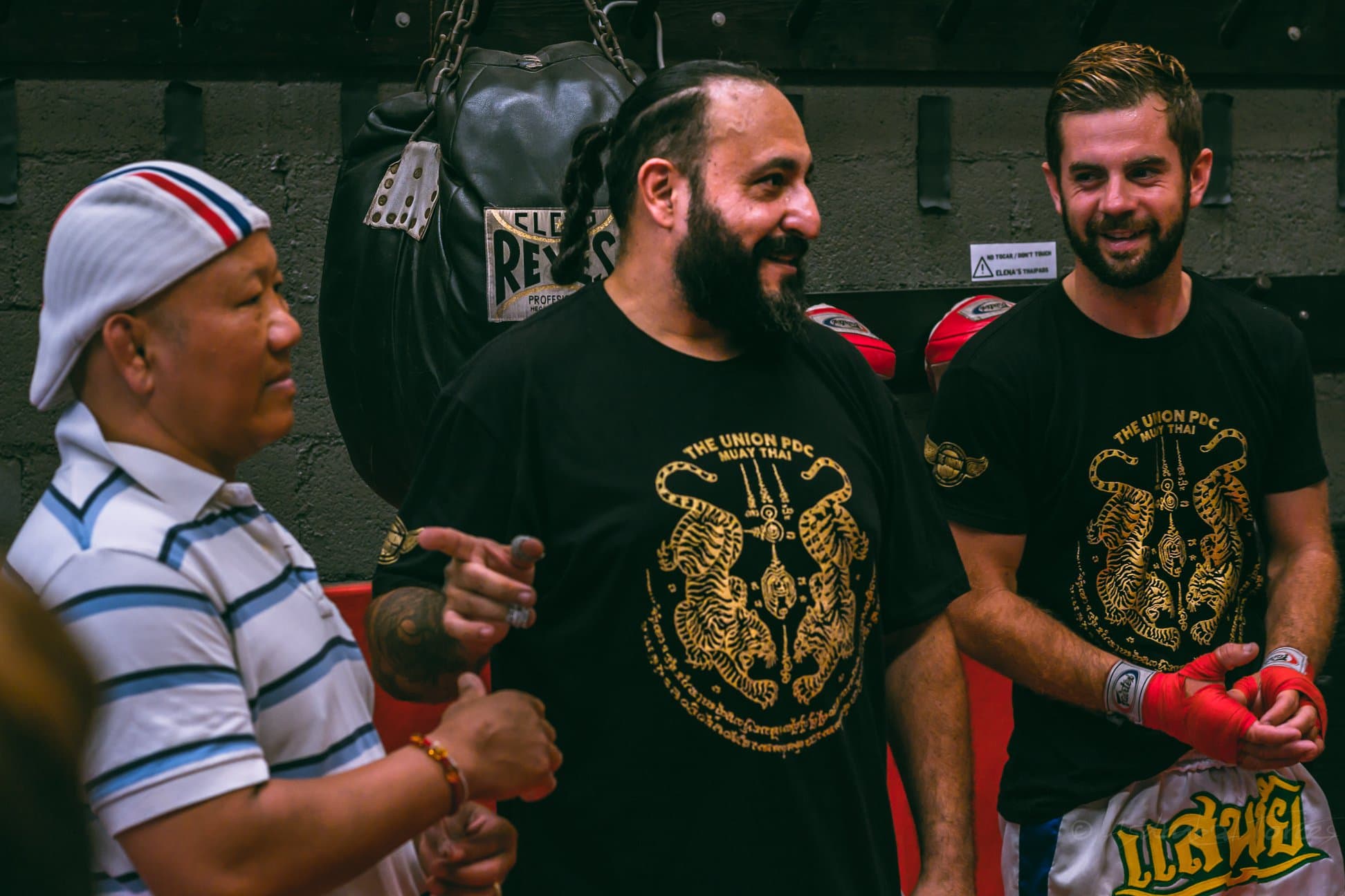 Coach Miguel 'Big Mike' Valdez with legendary Lumpinee Champion Bunkerd Faphimai at The Union Muay Thai & Boxing Gym, showcasing authentic Fairtex Muay Thai lineage and Golden Era training expertise