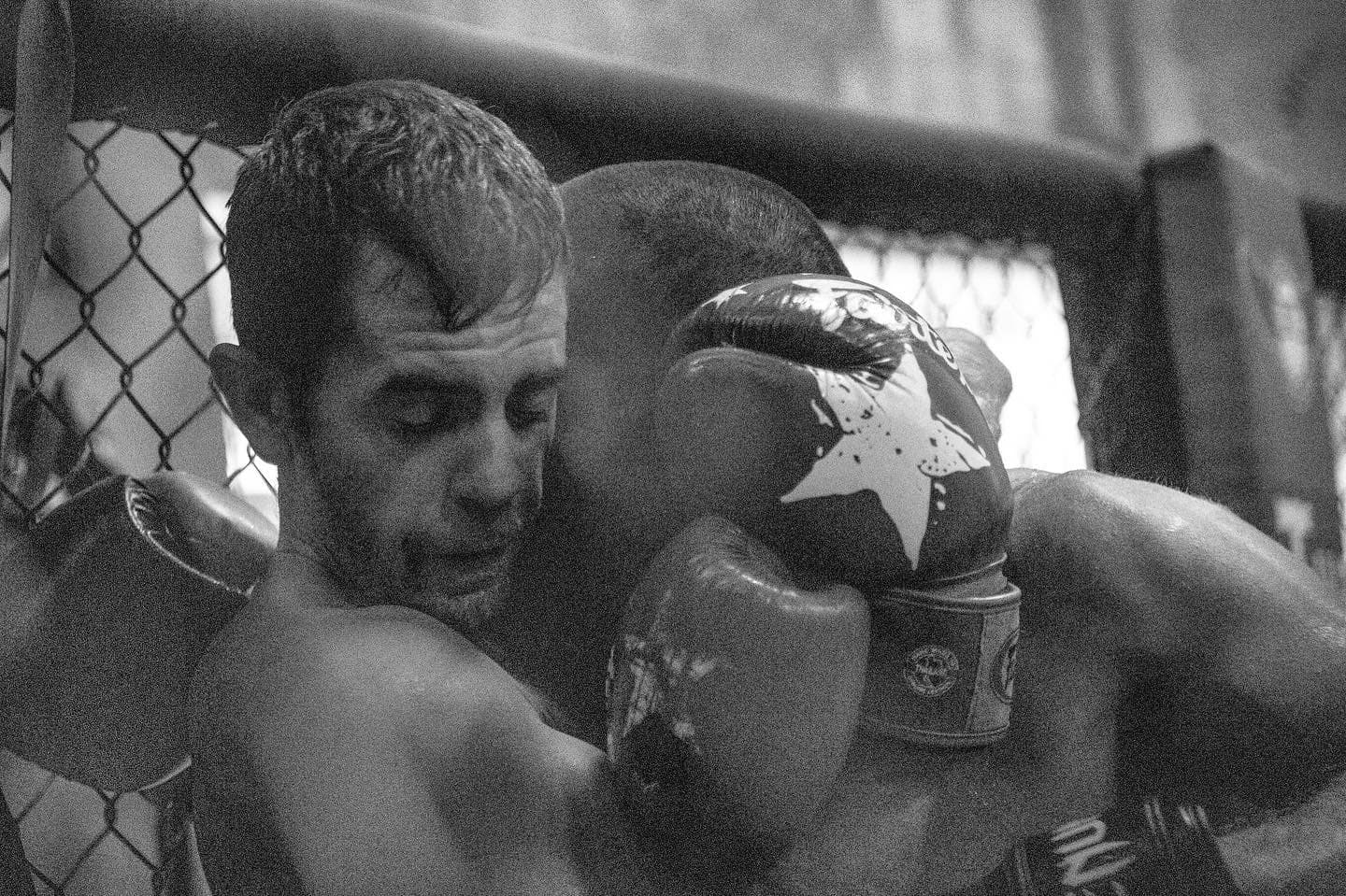 Muay Thai clinch technique training at The Union Gym, showing fighters practicing close-range combat and traditional clinch work in Playa del Carmen